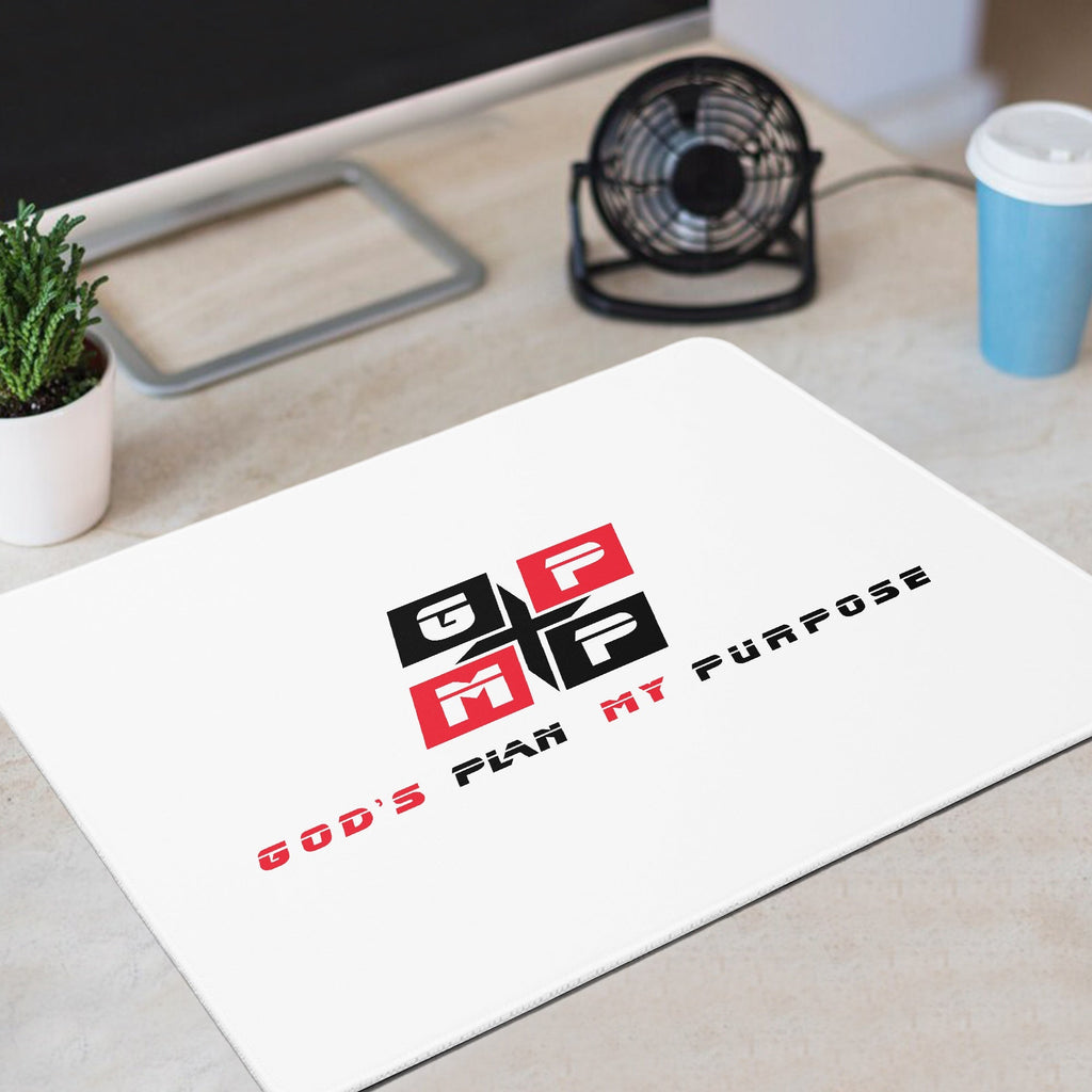 GPMP Premium White Mouse Pad on desk setup with fan and plant, anti-skid rubber base.