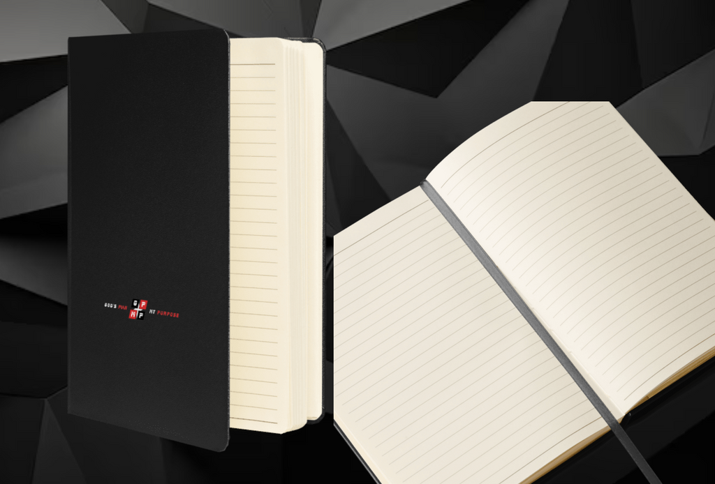 GP:MP Black Ice Journal with black UltraHyde cover and cream-colored lined pages, featuring an elastic closure and ribbon marker.