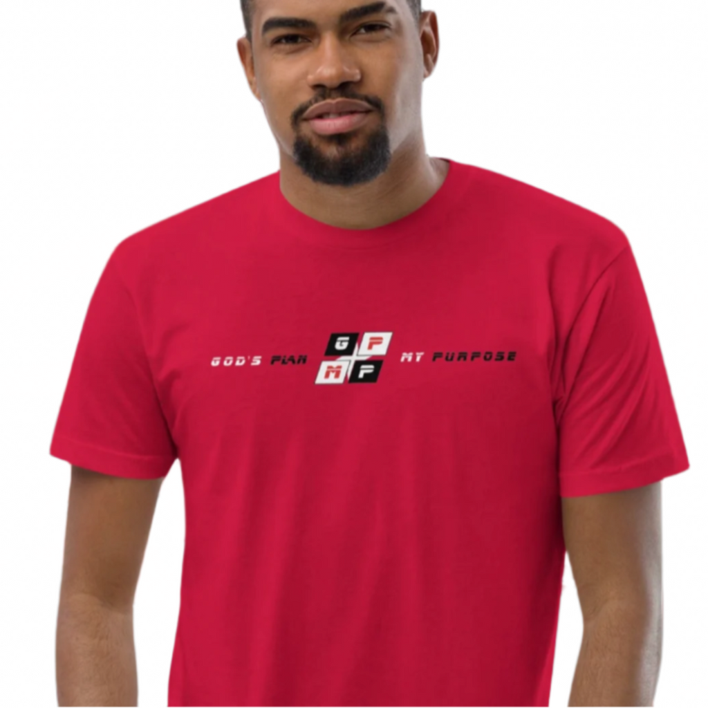 Red Heat Tee in vibrant red worn by a person against a geometric red and black background.